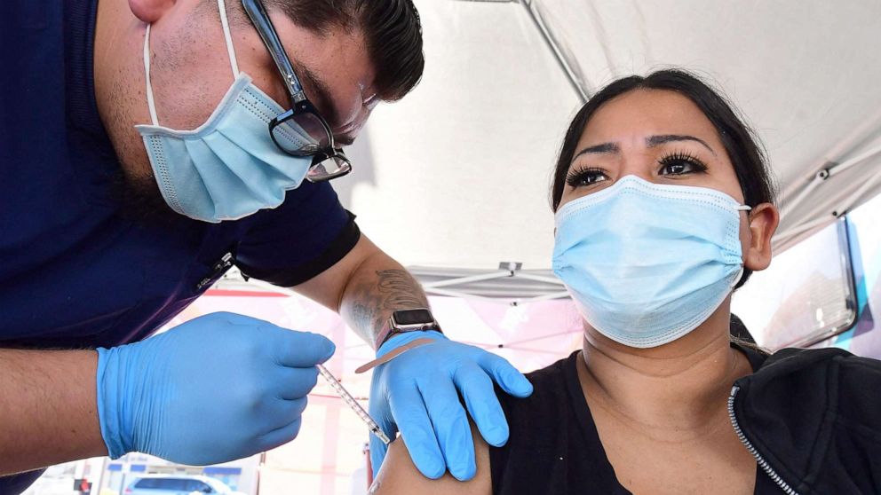 PHOTO: A woman receives her first dose of the Pfizer Covd-19 vaccine at a pop-up clinic   in Rosemead, Calif., Nov. 29, 2021.