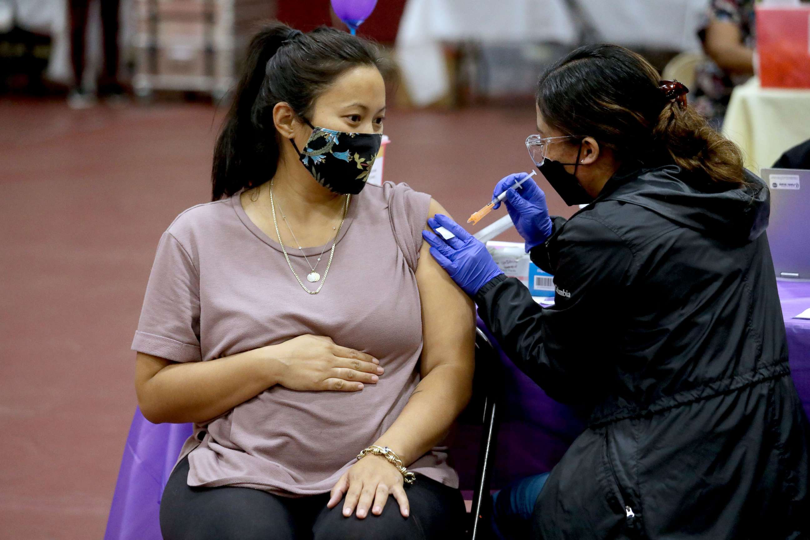 PHOTO: A pregnant woman receives a Pfizer vaccination booster shot at Eugene A. Obregon Park on Nov. 3, 2021, in Los Angeles.