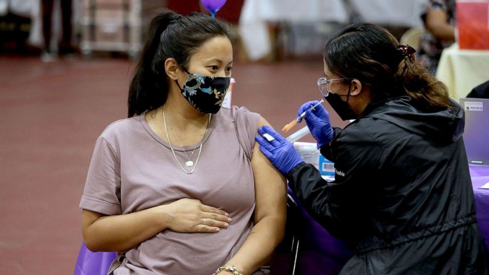 PHOTO: A pregnant woman receives a Pfizer vaccination booster shot at Eugene A. Obregon Park on Nov. 3, 2021, in Los Angeles.