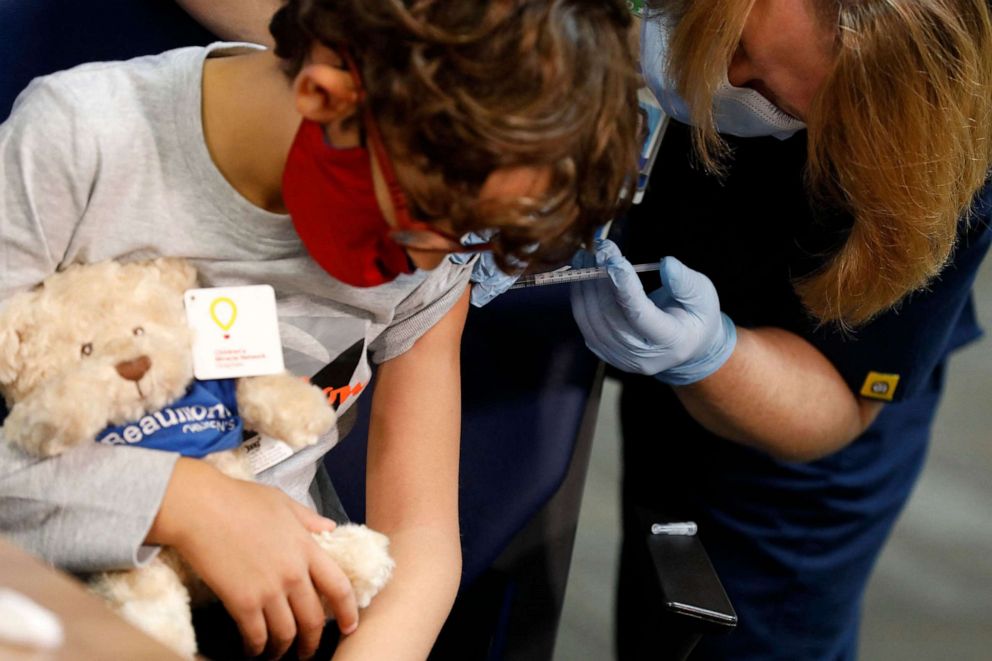 PHOTO: In this file photo taken on Nov. 05, 2021, a 7 year-old child receives their first dose of the Pfizer Covid-19 vaccine at the Beaumont Health offices in Southfield, Mich.