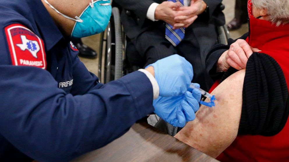 PHOTO: A COVID-19 shot is administed at a mass vaccination site inside the Esports Stadium Arlington & Expo Center in Arlington, Texas, Jan. 11, 2021.