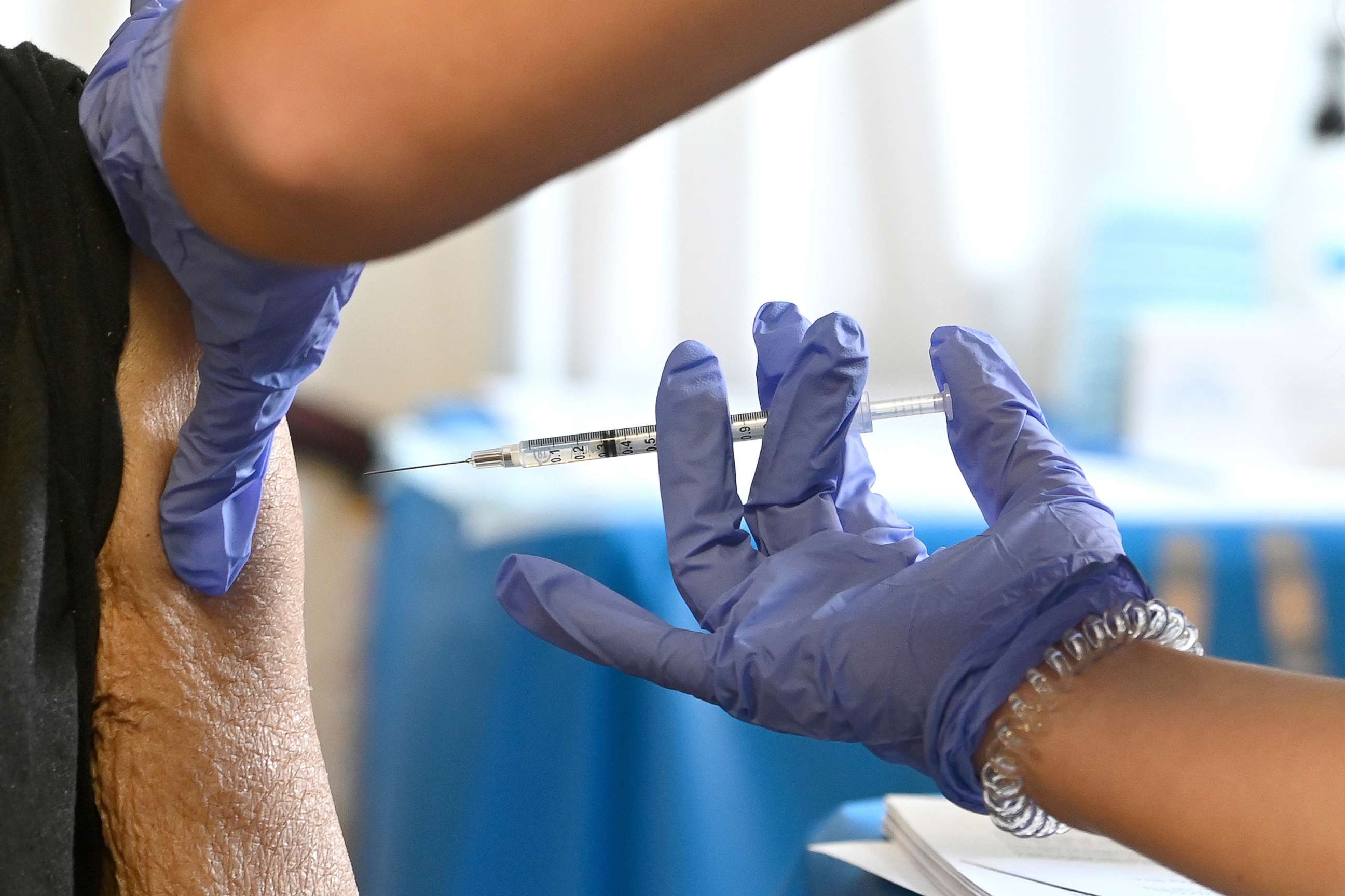 PHOTO: A registered nurse administers a dose of COVID-19 vaccine to an 85 year-old woman at a state run vaccine hub inside the Allen Senior Citizens Housing Complex in Queens, New York, Feb. 20, 2021.