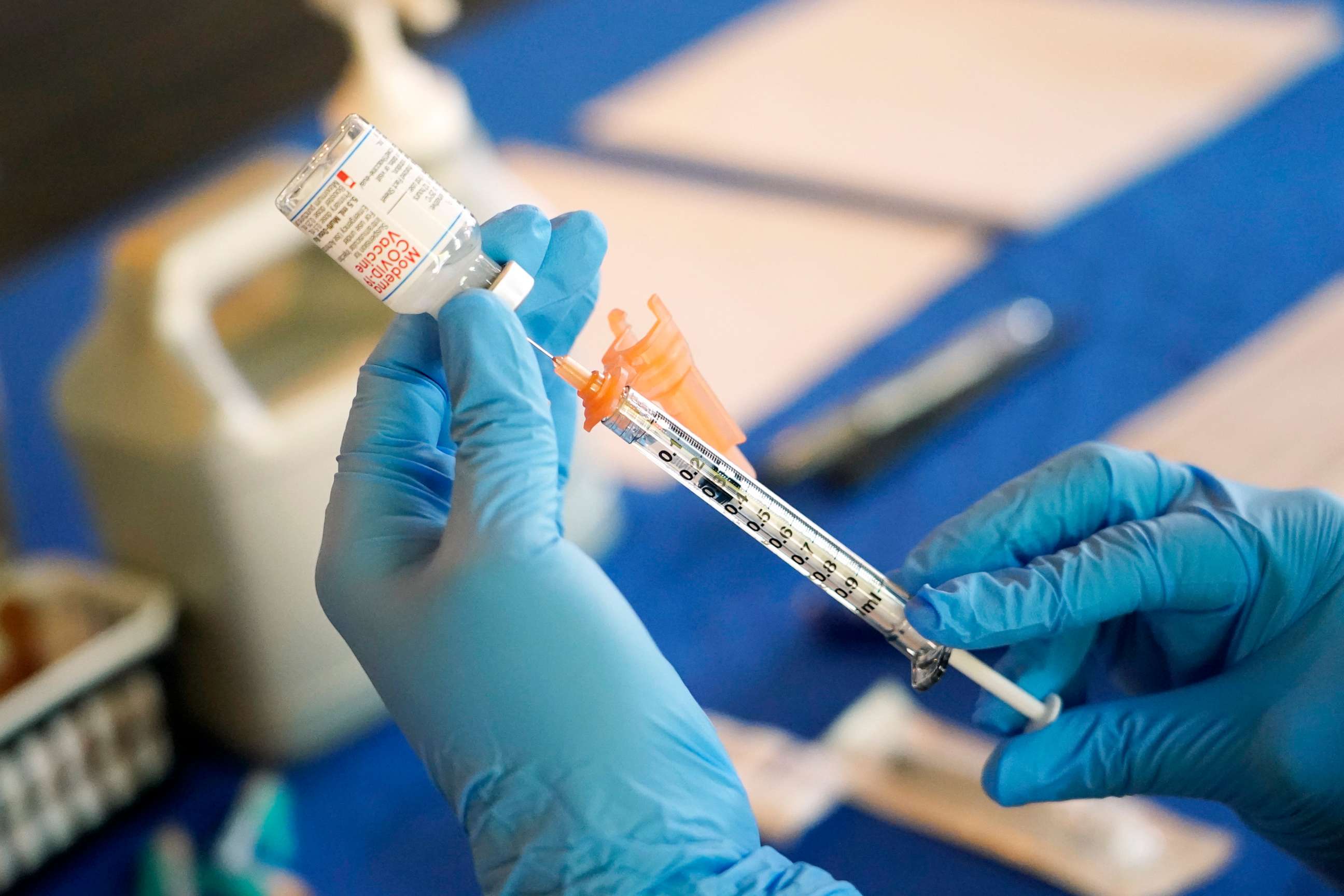 PHOTO: A nurse prepares a syringe of a COVID-19 vaccine at an inoculation station in Jackson, Miss., July 19, 2022.