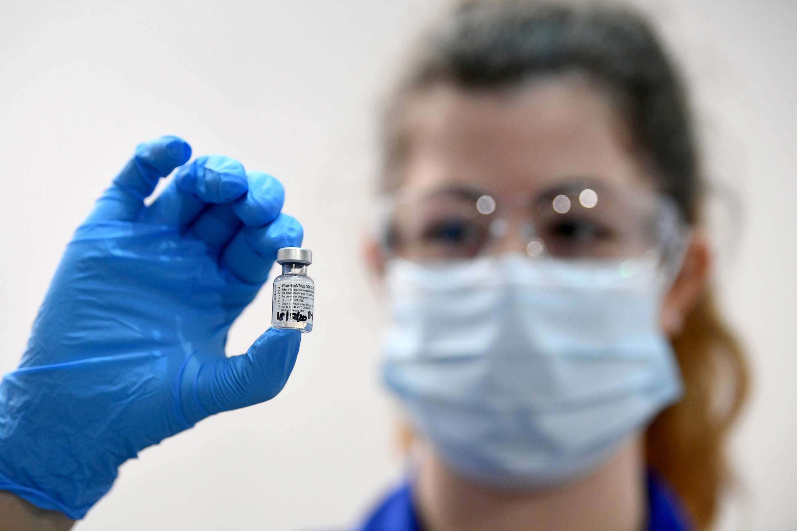 PHOTO: A member of medical staff holds a phial of the Pfizer/BioNTech COVID-19 vaccine at Guy's Hospital, on the first day of the largest immunization program in the British history, in London, Dec. 8, 2020.