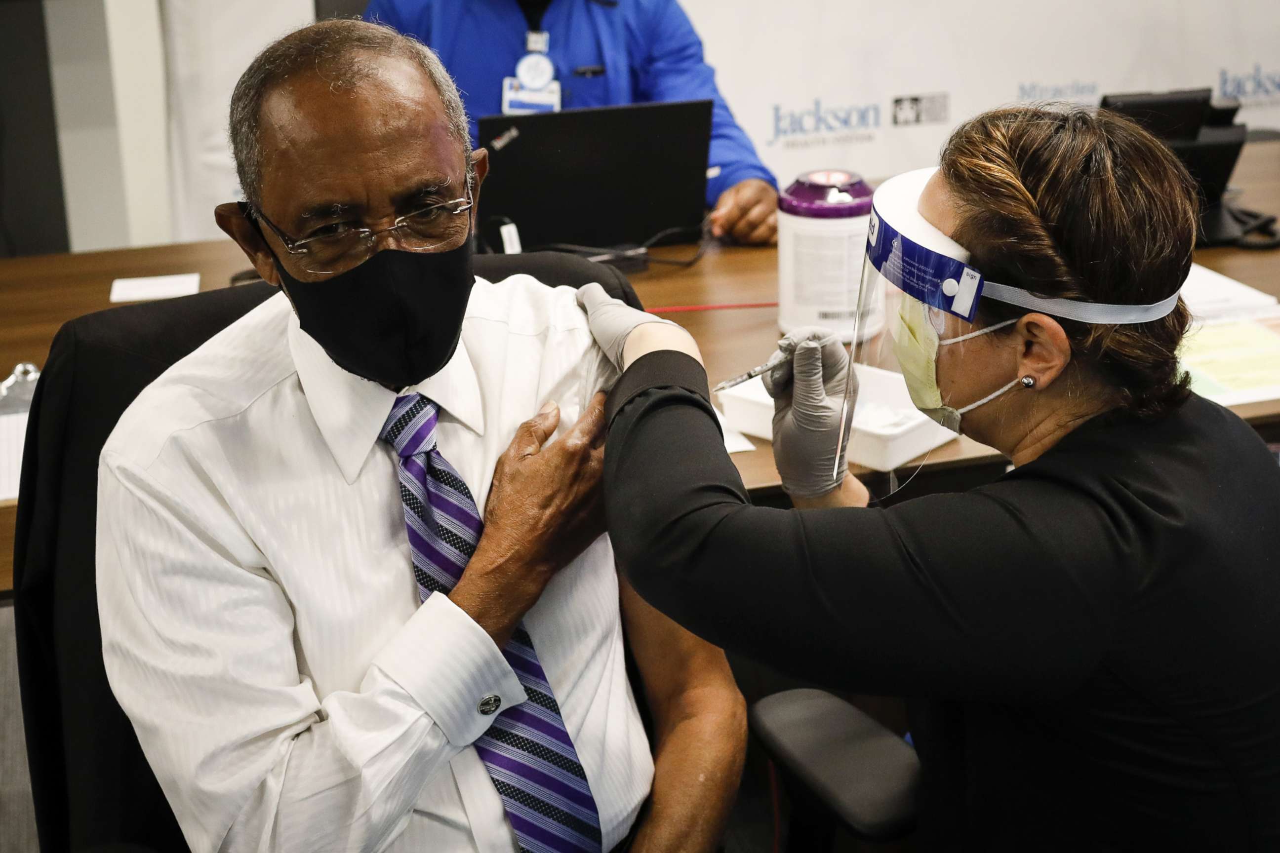 PHOTO: In this Dec. 30, 2020, file photo, a healthcare worker gives the Pfizer/BioNTech vaccine to Patrick Range, Sr, 88, as part of COVID-19 vaccination plan for the seniors at the Jackson Memorial Hospital in Miami.