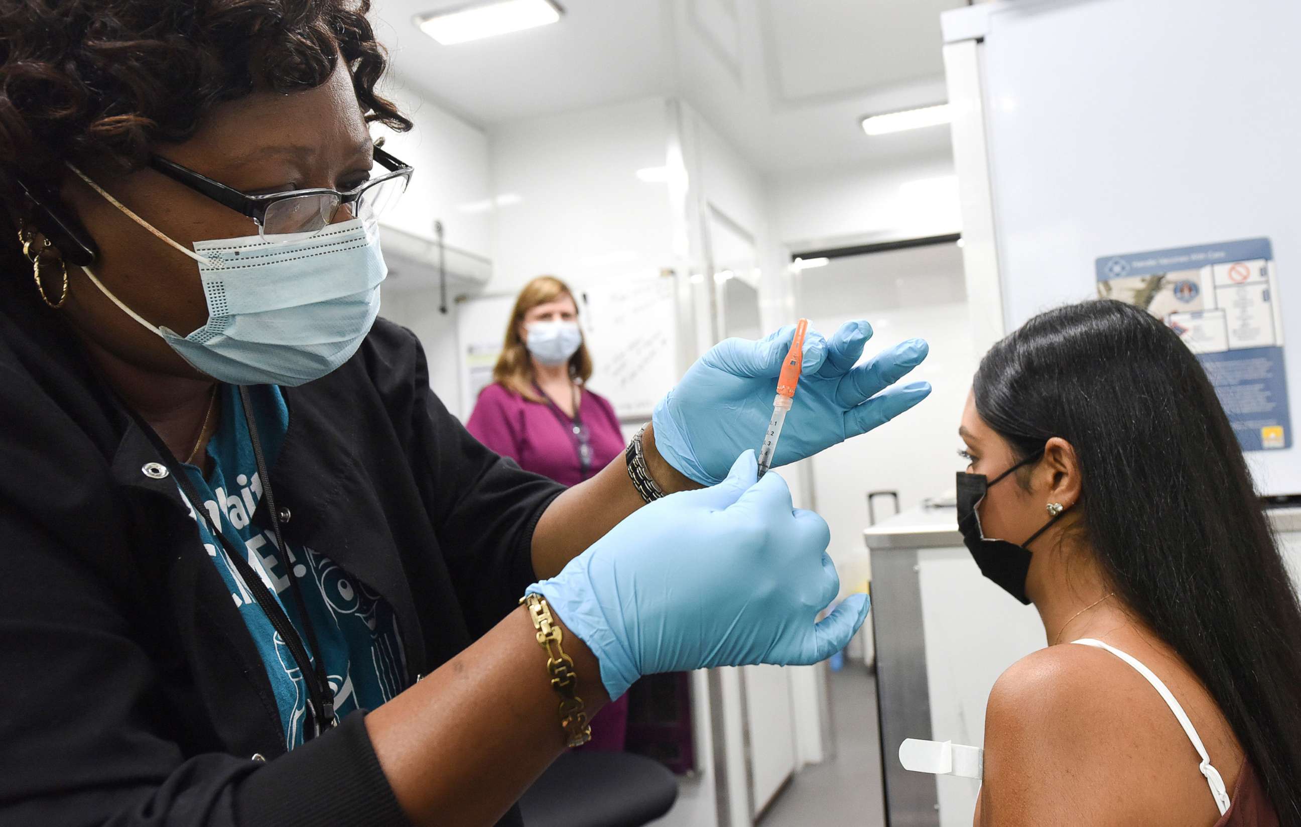 PHOTO: A nurse prepares to administer a dose of COVID-19 vaccine to a patient at a mobile vaccination event at the downtown Orlando campus of the University of Central Florida and Valencia College in Orlando, Fla., July 24, 2021.