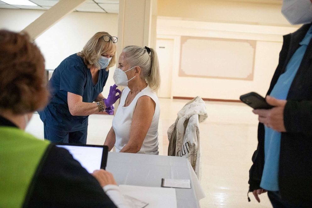 PHOTO: In this April 8, 2022, file photo, a 50-year-old immunocompromised resident receives a second booster shot of the COVID-19 vaccine in Waterford, Mich.