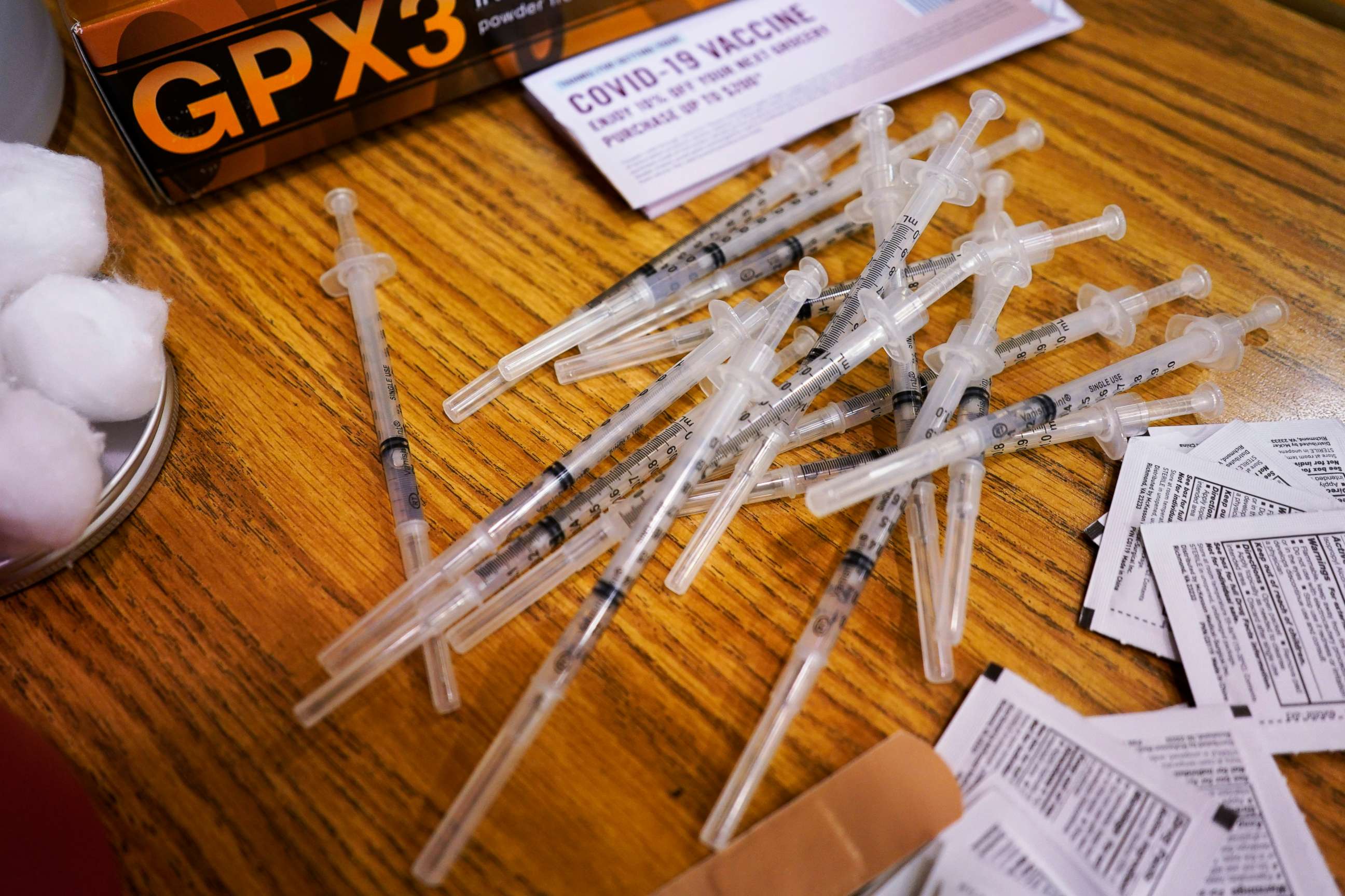 PHOTO: Prepared Pfizer COVID-19 vaccine syringes wait for patients at a middle school in Wheeling, Ill., June 11, 2021.