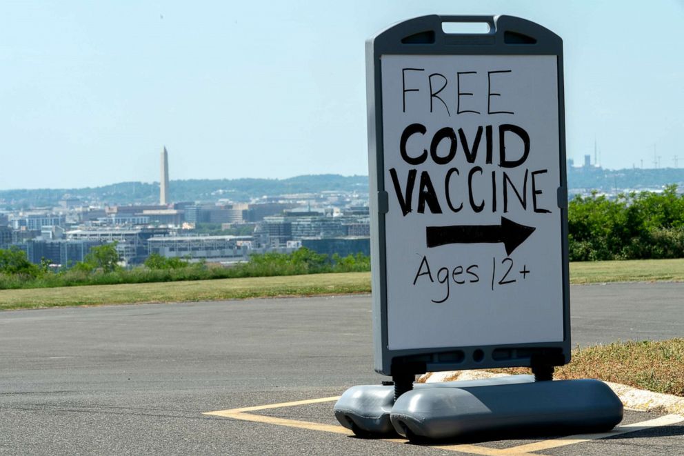 PHOTO: In this May 19, 2021, file photo, a sign advertises a free vaccine drive with Pfizer COVID-19 vaccinations for members of the community 12 years and up, May 19, 2021, at a clinic held by Community of Hope, in Washington, D.C.
