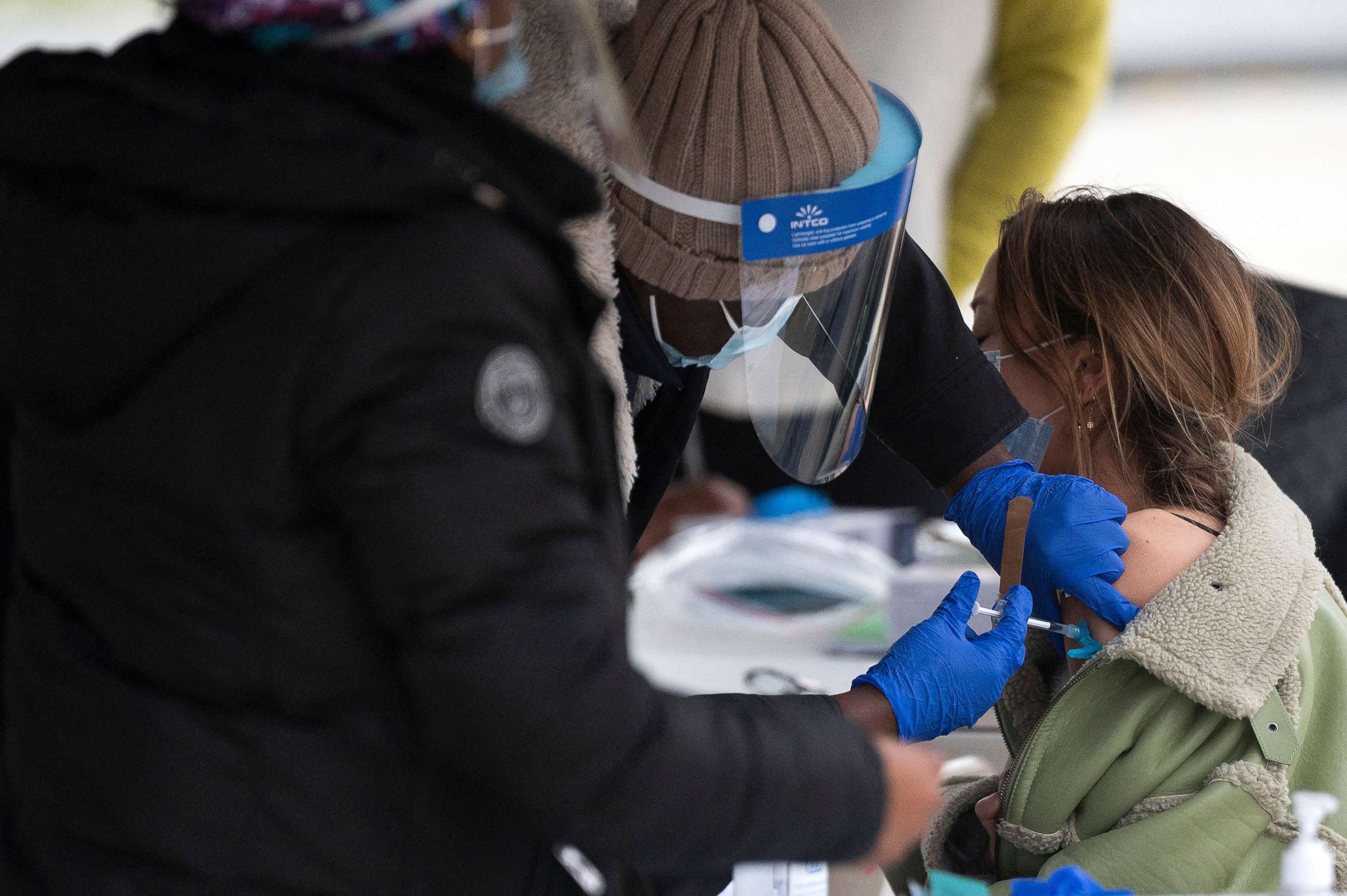 PHOTO: In this Nov. 29, 2021, file photo, a person gets a Covid-19 vaccination at an outdoor walk-up vaccination site within Franklin Park in Washington, D.C.