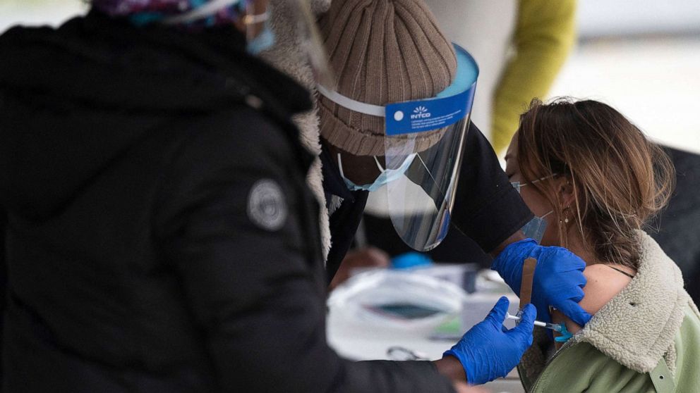 PHOTO: In this Nov. 29, 2021, file photo, a person gets a Covid-19 vaccination at an outdoor walk-up vaccination site within Franklin Park in Washington, D.C.
