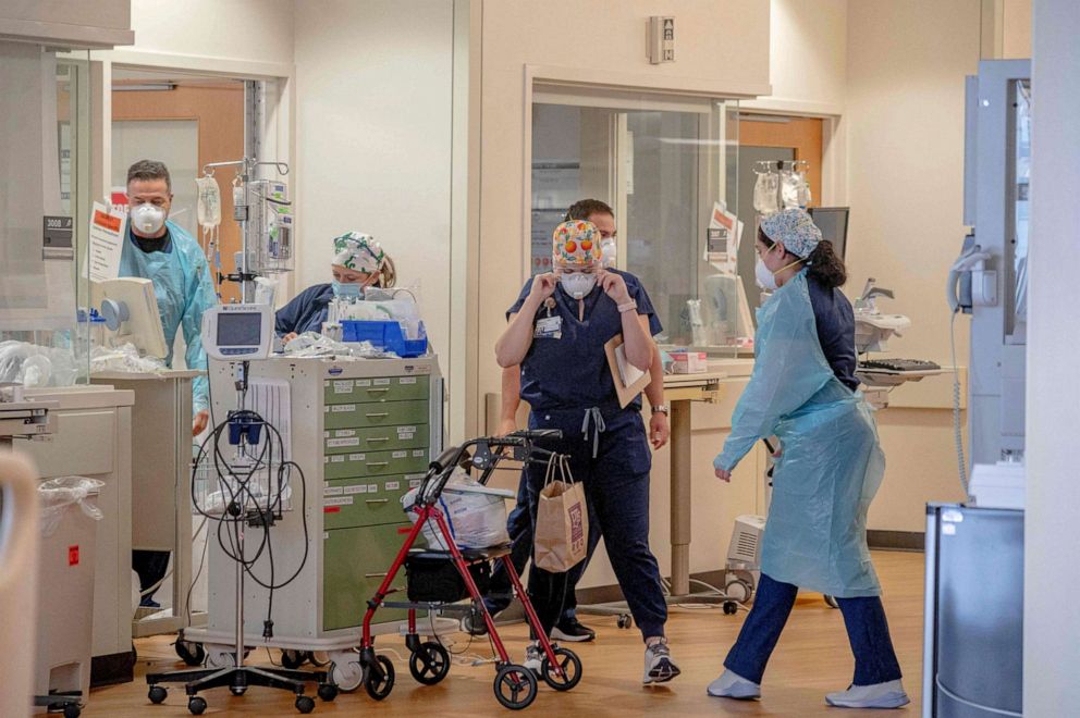 PHOTO: Healthcare workers are seen inside the Covid Intensive Care Unit in North Oaks Hospital in Hammond, La., Aug. 13, 2021.