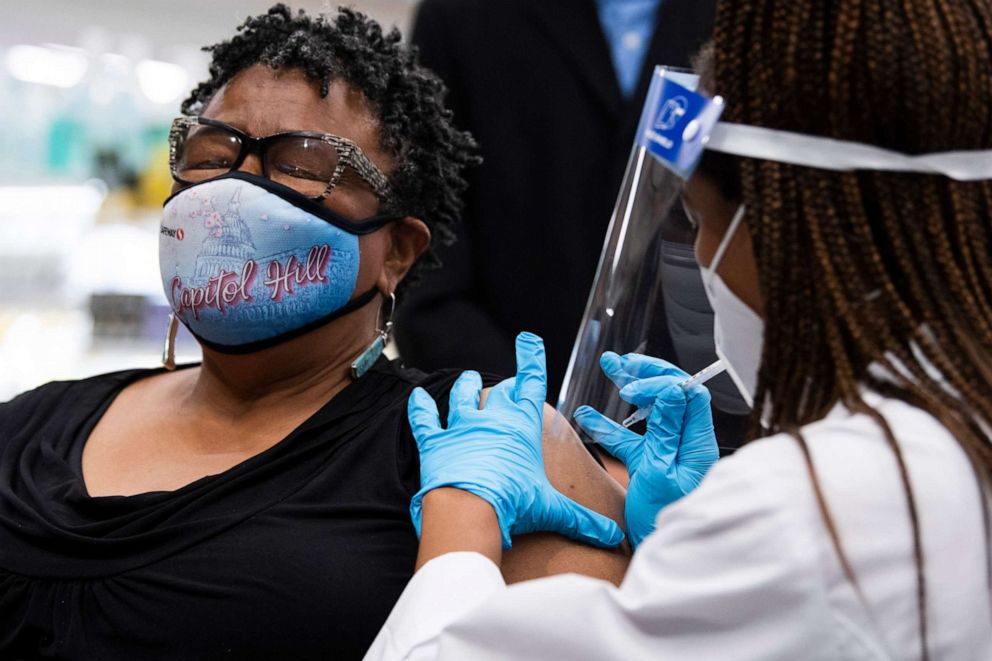 PHOTO: Germaine T. Leftwich, 67, receives a Pfizer covid-19 vaccine booster shot from Dr. Tiffany Taliaferro at the Safeway on Capitol Hill, Oct. 4, 2021.