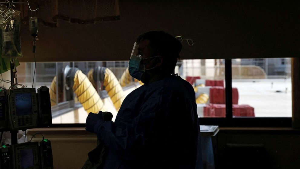 PHOTO: A nurse treats a coronavirus disease patient in the Intensive Care Unit at St. Mary Medical Center in Apple Valley Calif., Feb. 1, 2022. 