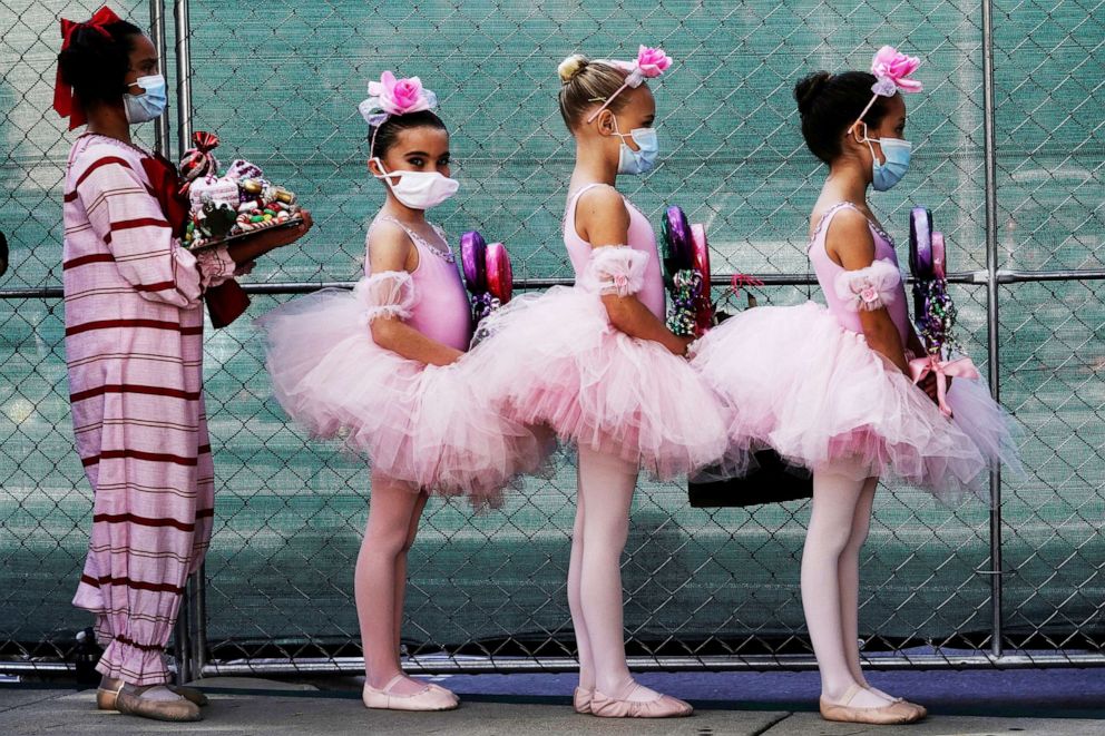 PHOTO: San Diego Ballet School students wear protective masks backstage during a performance of "The Nutcracker" in San Diego, Calif., Dec. 5, 2020.