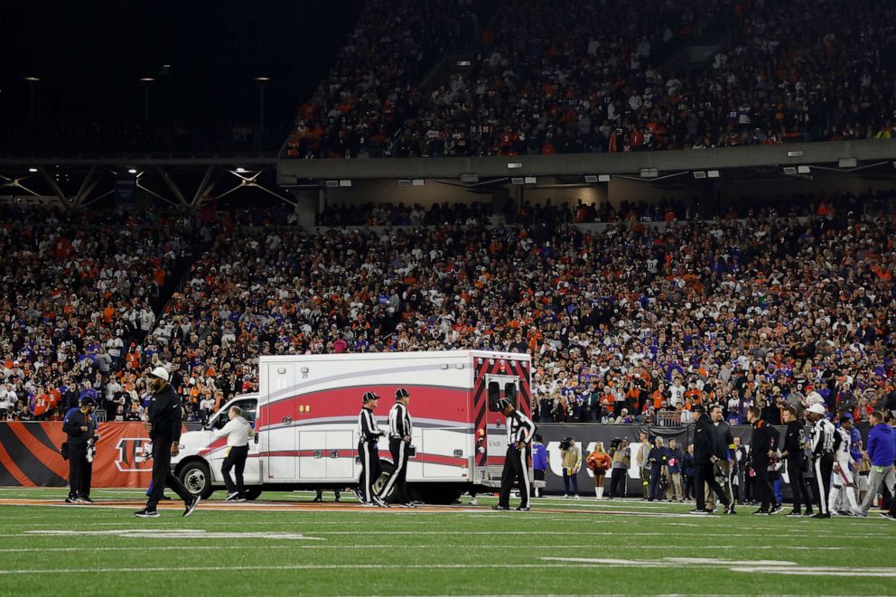 PHOTO: Fans look on as the ambulance leaves carrying Damar Hamlin of the Buffalo Bills after he collapsed following a tackle against the Cincinnati Bengals during the first quarter at Paycor Stadium, Jan. 2, 2023, in Cincinnati.