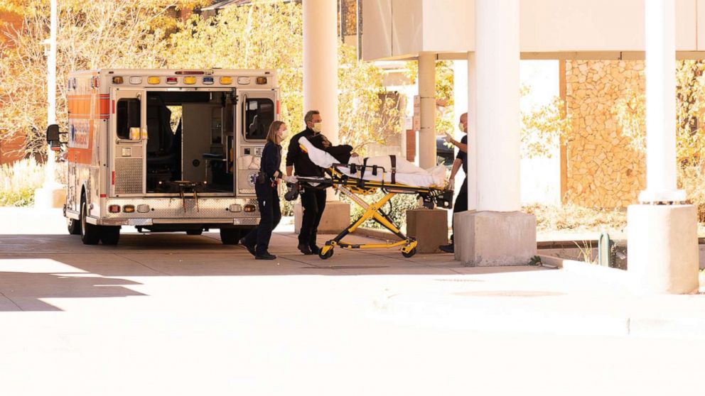 PHOTO: An ambulance crew wheels a person on a stretcher outside the emergency entrance of the Denver Health Hospital Complex in Denver, Nov. 4, 2021.