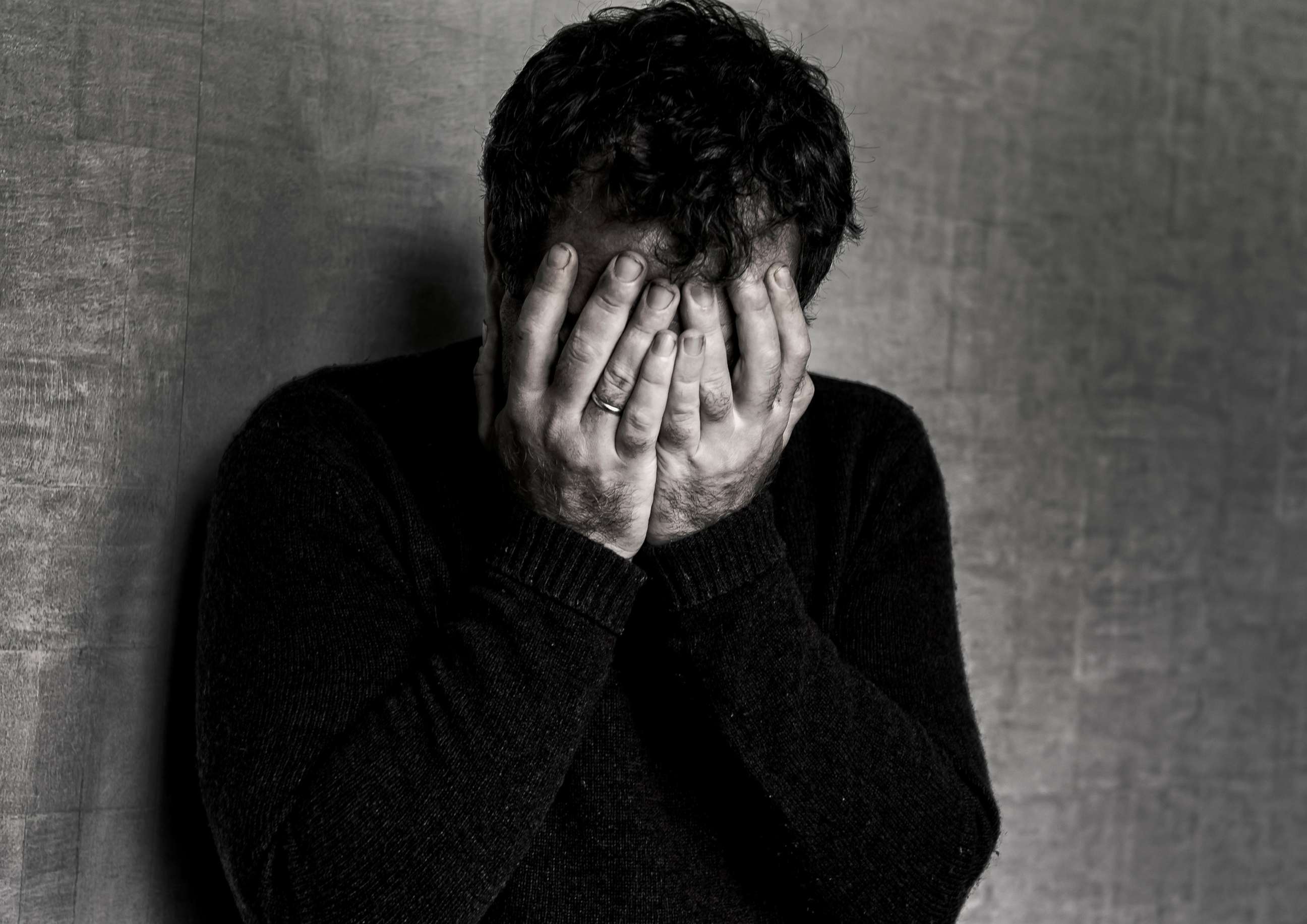 PHOTO: A man covers his face in this undated stock photo.