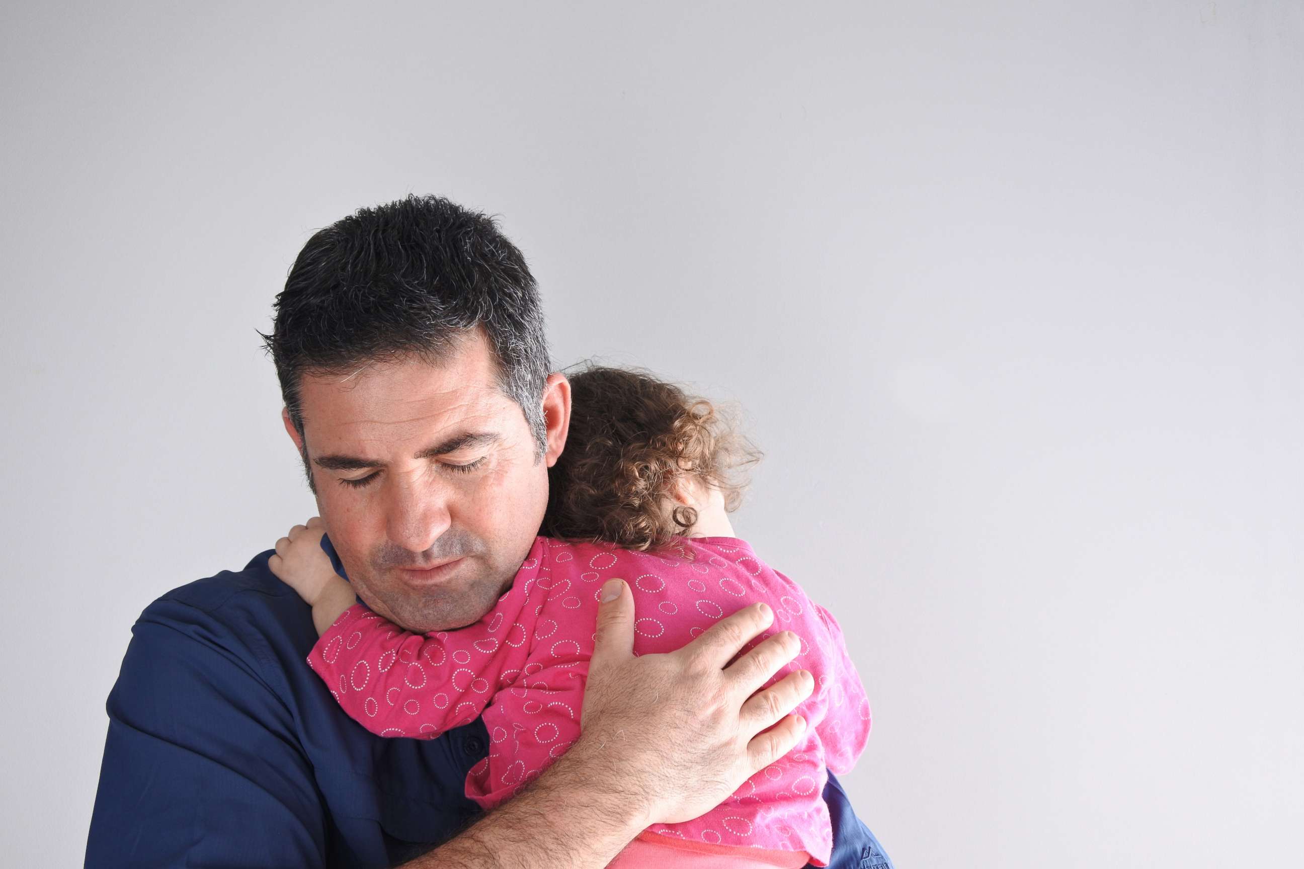 PHOTO: A father holds his child in an undated stock photo. 