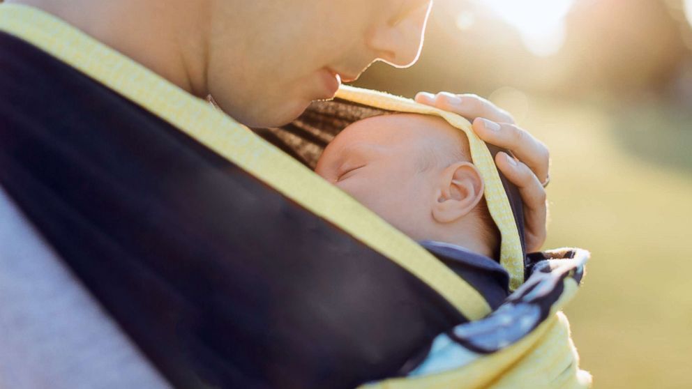 PHOTO: A father holds his baby in an undated stock photo. 