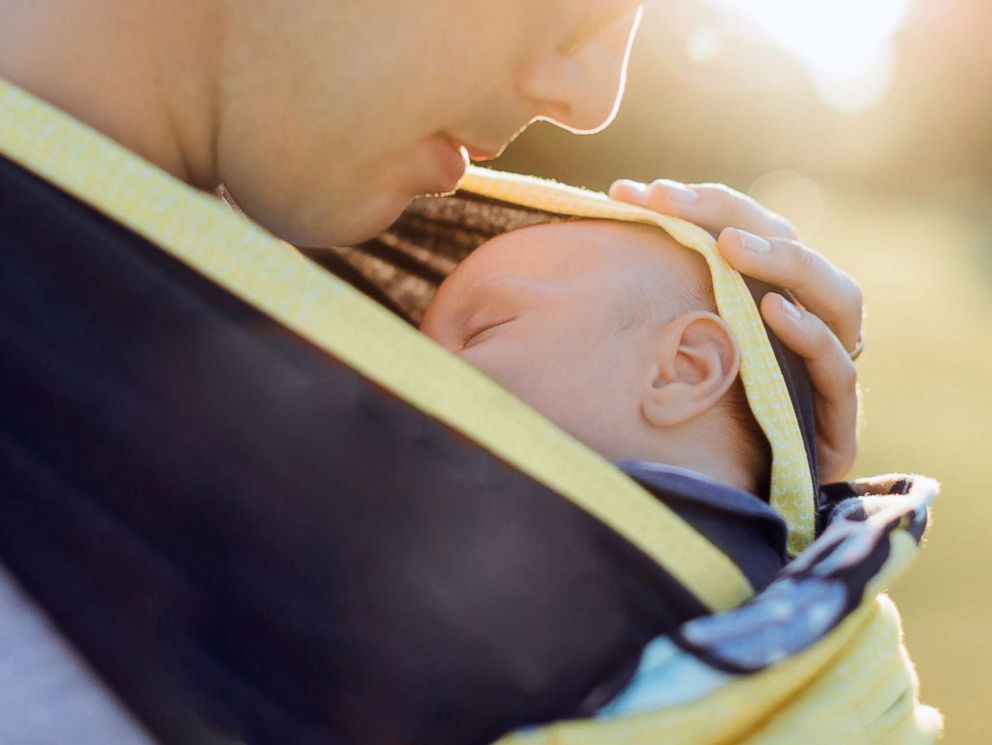 PHOTO: A father holds his baby in an undated stock photo.