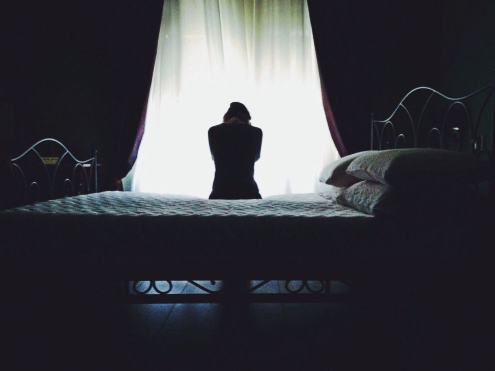 PHOTO: A woman on a bed in an undated stock photo.