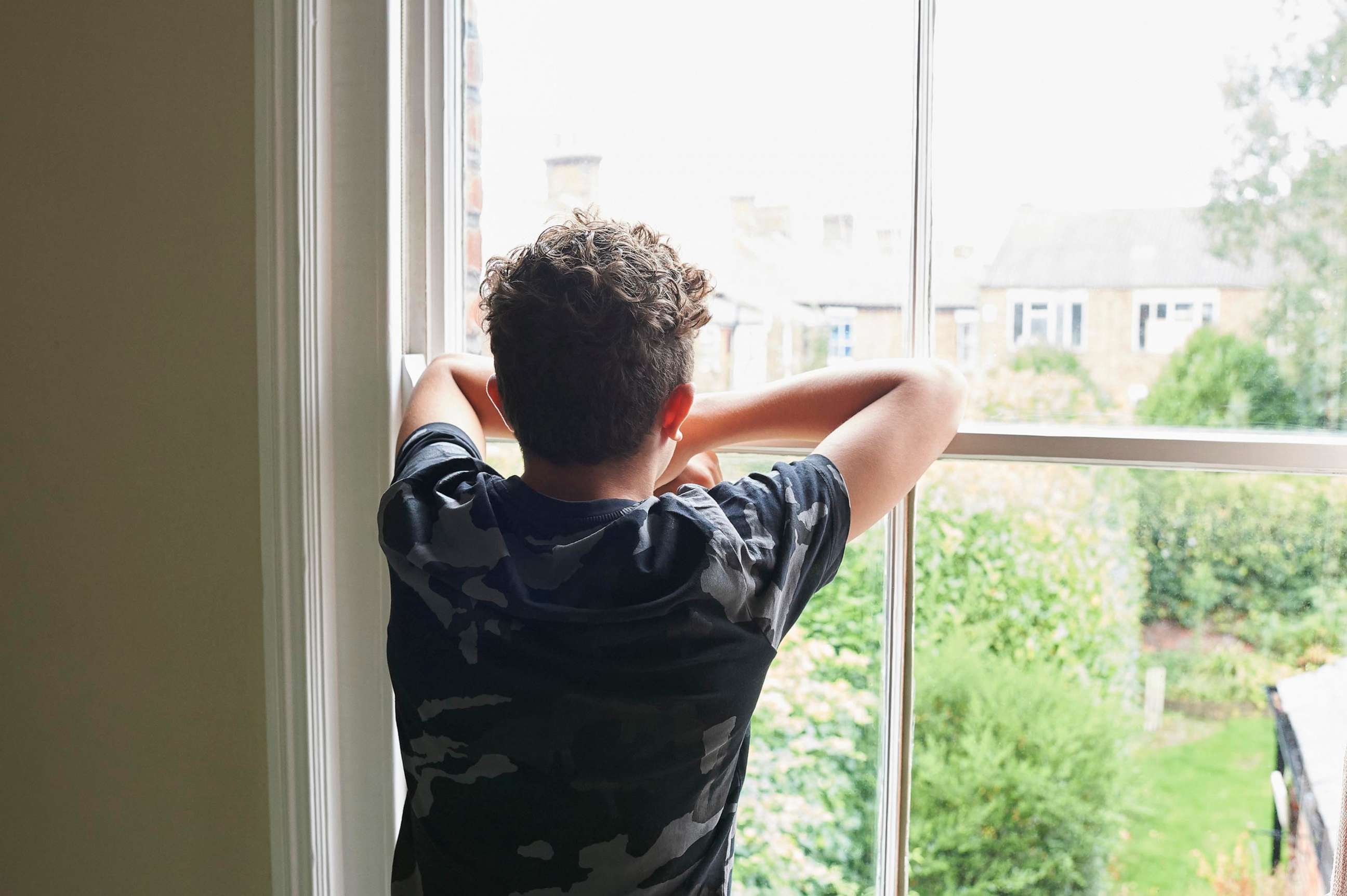 PHOTO: sad boy at window