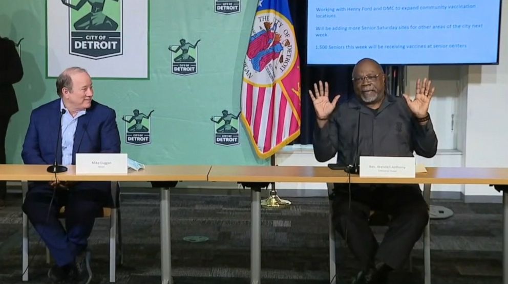 PHOTO: Detroit Mayor Mike Duggan watches as Rev. Dr. Wendell Anthony, the Pastor of Fellowship Chapel, talks about the "Senior Saturday" program to vaccinate senior citizens at churches, during a press conference in Detroit, in February 2021.