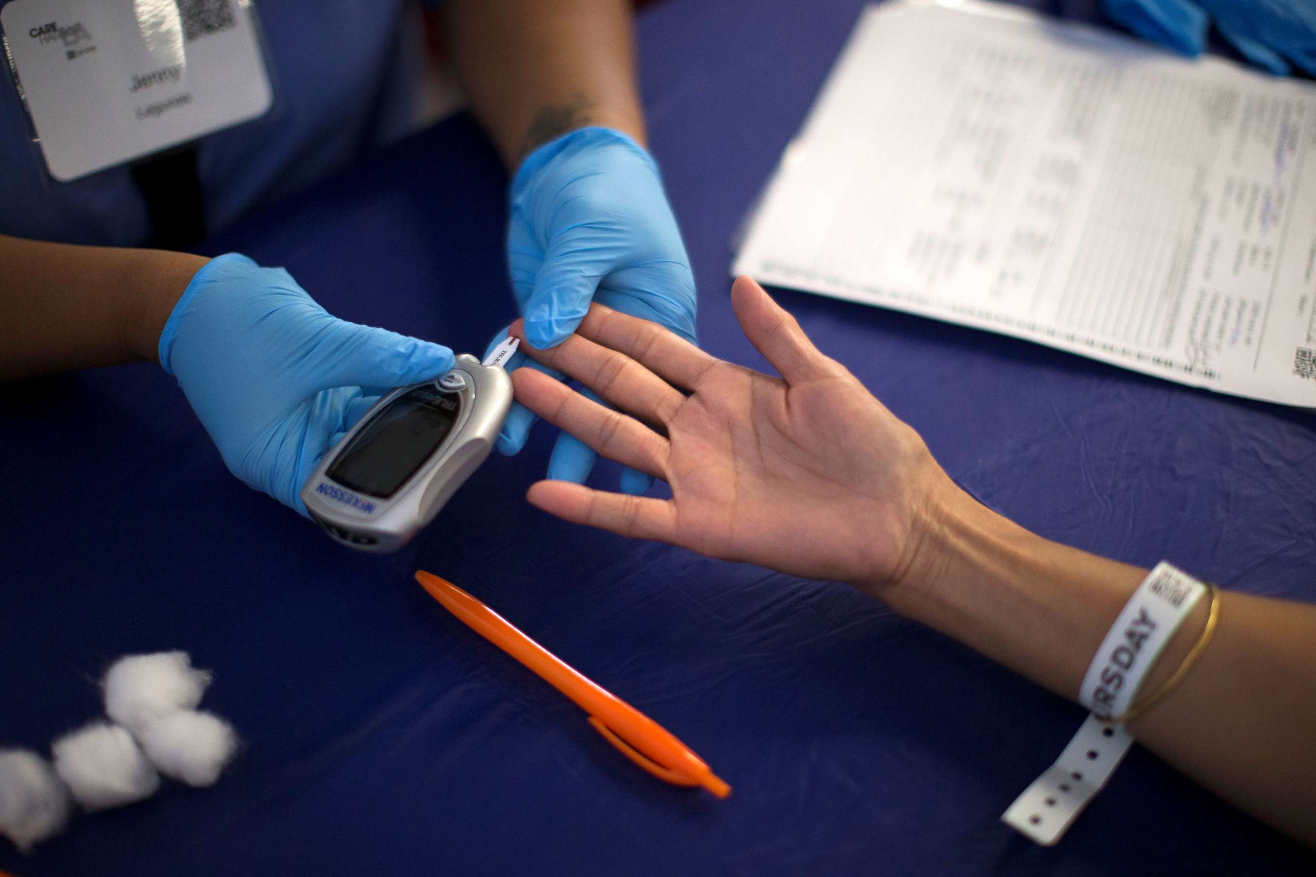 PHOTO: A person receives a test for diabetes during Care Harbor LA free medical clinic in Los Angeles, Sept. 11, 2014.