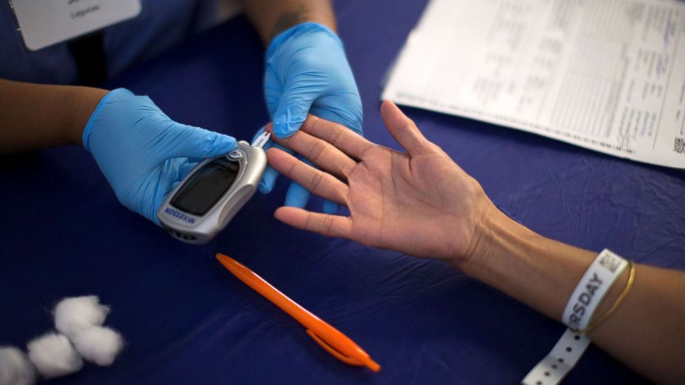 PHOTO: A person receives a test for diabetes during Care Harbor LA free medical clinic in Los Angeles, Sept. 11, 2014.