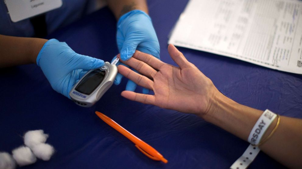 A person receives a test for diabetes during Care Harbor LA free medical clinic in Los Angeles, Sept. 11, 2014.