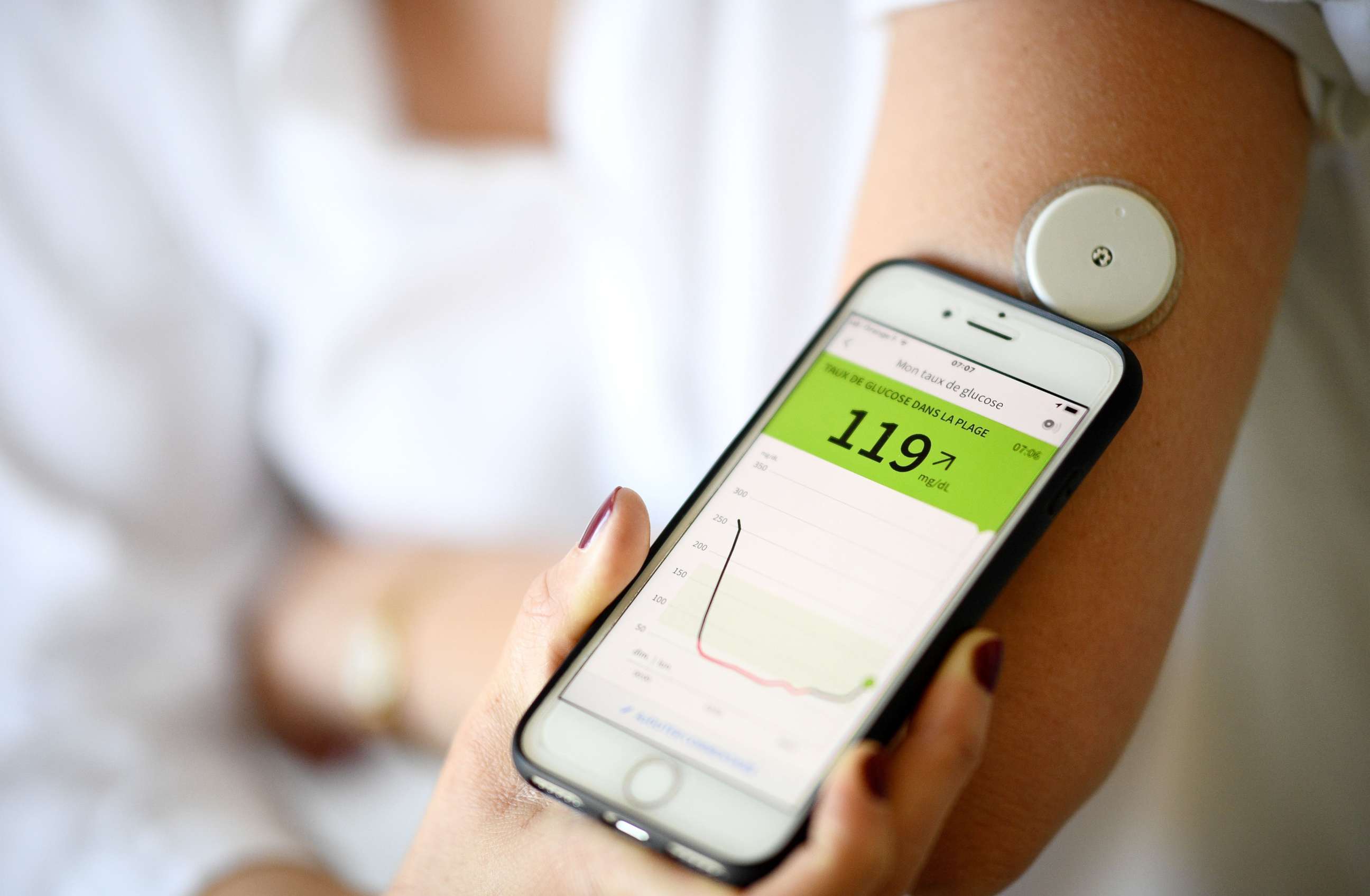 PHOTO: A woman with diabetes monitors her glycemia in Paris on March 24, 2020, on the eighth day of a strict lockdown in France aimed at curbing the spread of COVID-19 caused by the novel coronavirus.