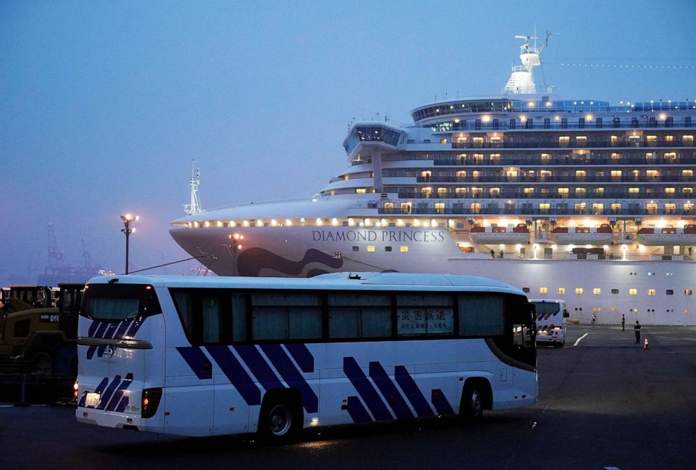 PHOTO: Buses with closed curtains arrive at the Daikoku Pier Cruise Terminal where the Diamond Princess cruise ship is docked in Yokohama, Tokyo, Feb. 16, 2020.