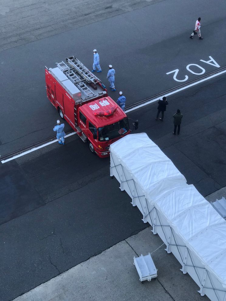 PHOTO: Military trucks prepare quarantine spaces on Diamond Princess cruise ship in Yokohama, Japan, Feb. 10, 2020, in this by passengers Philip and Gay Courter.
