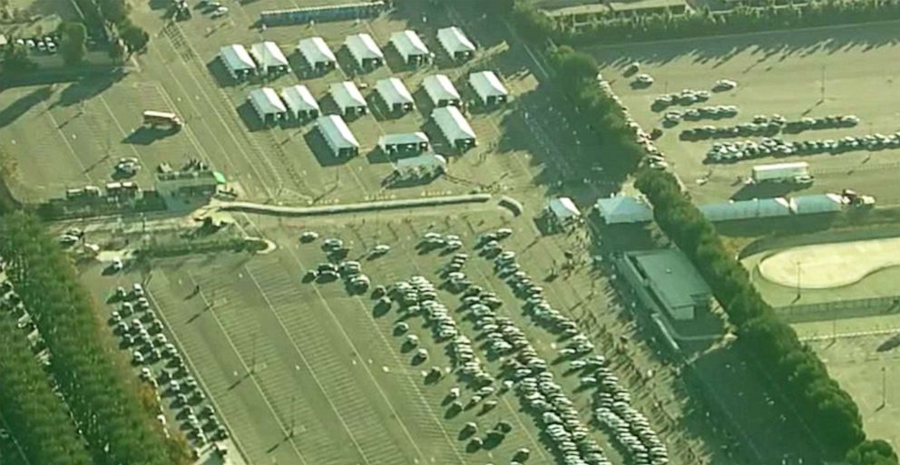 PHOTO: Long lines form to get the COVID vaccine at the Disneyland Resort in Anaheim, Calif., Jan. 13, 2021.
