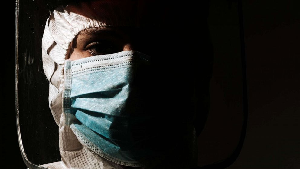 STOCK PHOTO: A Doctor wears mask and face shield due to Coronavirus