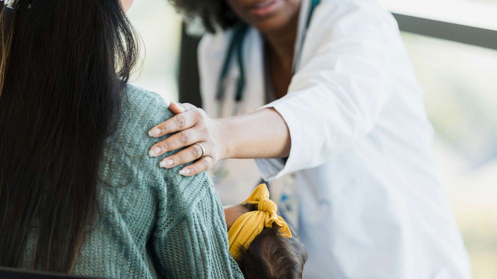 PHOTO: A stock photo of a doctor consoling a new mother.