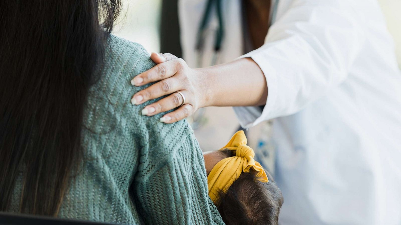 PHOTO: A stock photo of a doctor consoling a new mother.