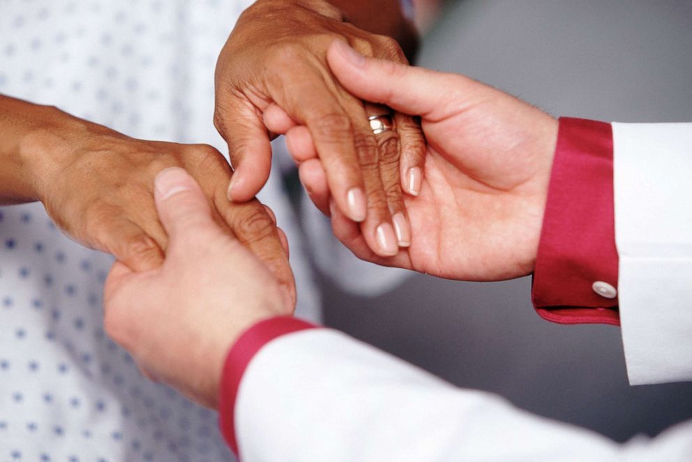 PHOTO: Undated stock photo depicts doctor holding patient's hands.