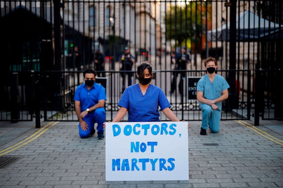 PHOTO: Doctors hold a silent protest outside Downing Street in London on May 28, 2020. 