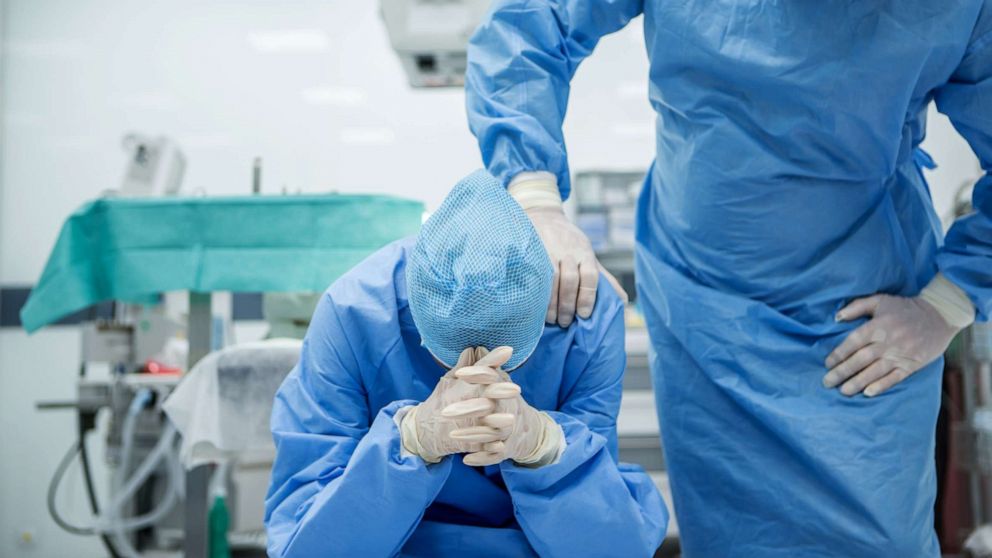 PHOTO: A doctor is consoled in this stock photo.