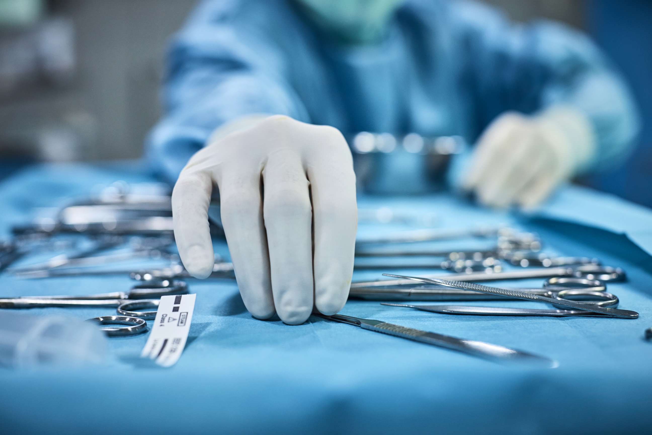 PHOTO: A doctor reaches for surgical instruments in this stock photo.
