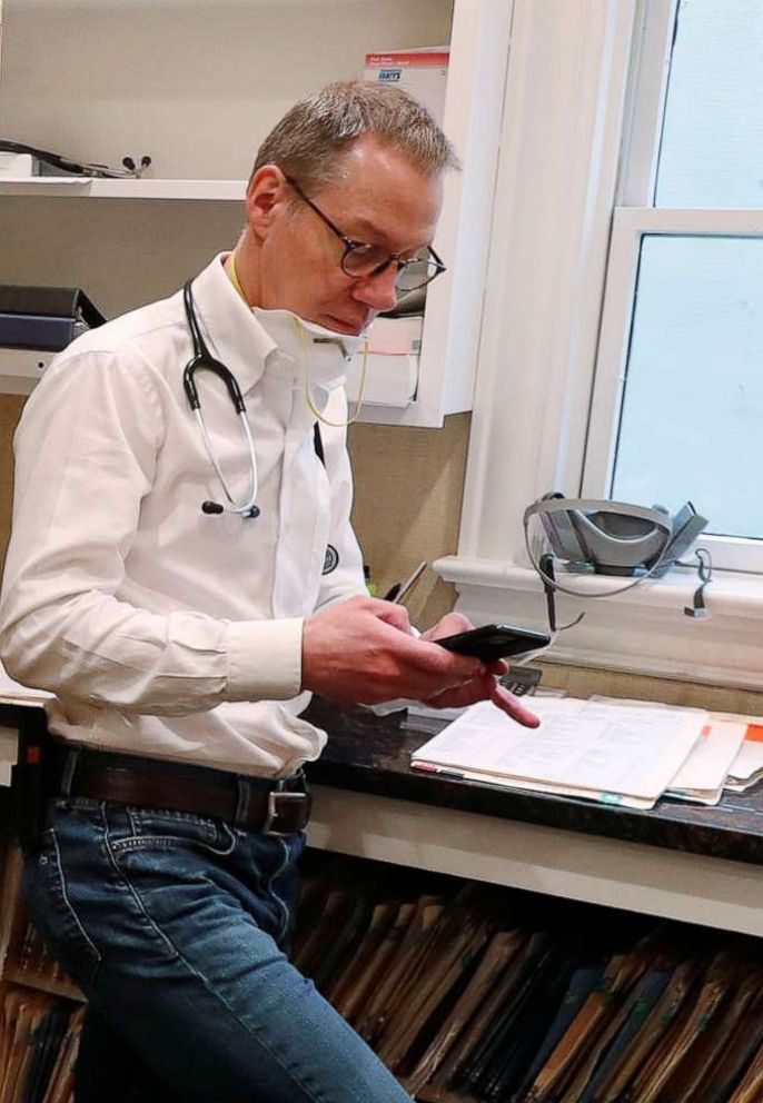 PHOTO: In this April 13, 2020, file photo, a doctor takes part in a telemedicine call with a patient while maintaining visits with both his regular patients and those confirmed to have the coronavirus disease (COVID-19).