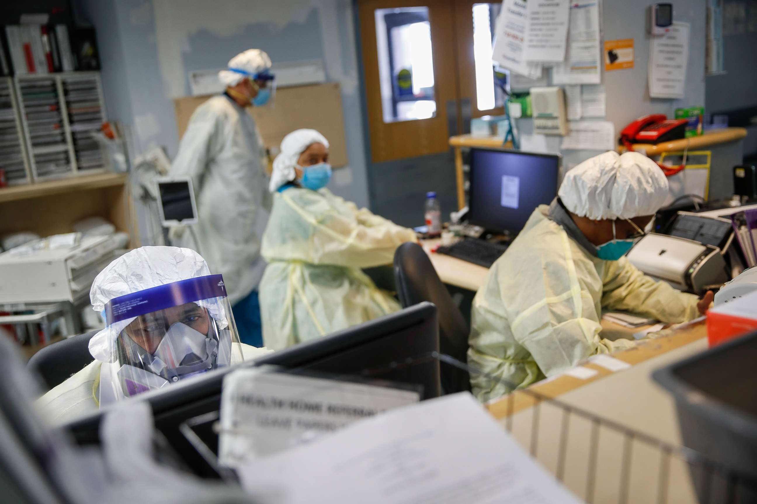 PHOTO: Emergency room doctors and nurses wear personal protective equipment while manning desks due to COVID-19 concerns at St. Joseph's Hospital, April 20, 2020, in Yonkers, N.Y.