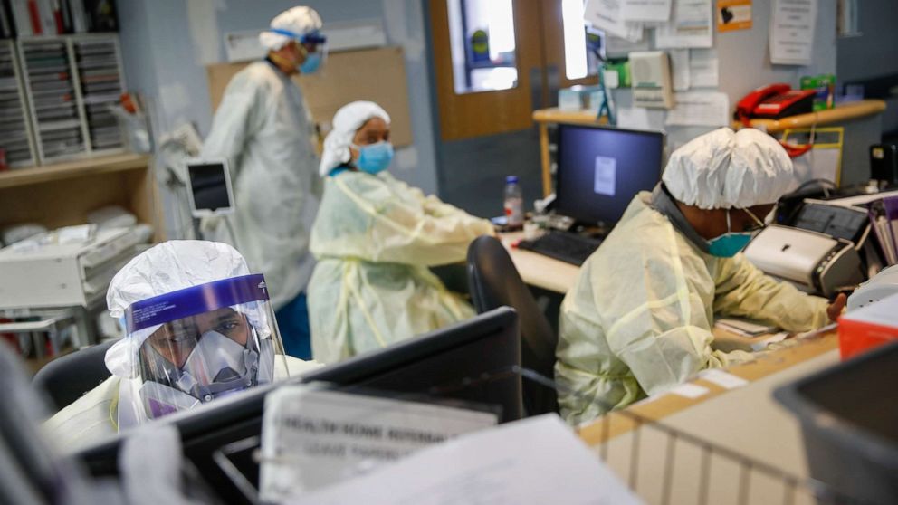 PHOTO: Emergency room doctors and nurses wear personal protective equipment while manning desks due to COVID-19 concerns at St. Joseph's Hospital, April 20, 2020, in Yonkers, N.Y.