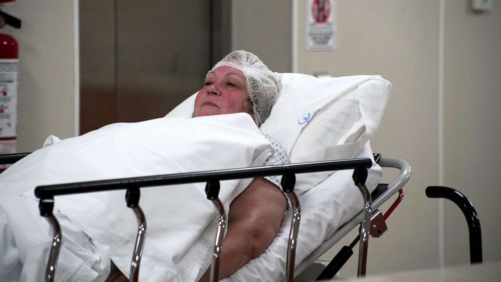 Donna Ferguson is wheeled into surgery at Galenia Hospital in Cancun, Mexico.