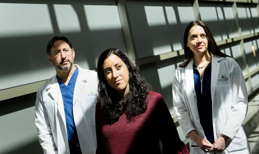 Organ donor Nina Martinez, center, poses with Dr. Dorry Segev, professor of surgery at the Johns Hopkins University School of Medicine, and Dr. Christine Durand, associate professor of medicine and oncology and member of the Johns Hopkins Sidney Kimmel Comprehensive Cancer Center after she participated in the first HIV-positive patient to HIV-positive patient kidney transplant, March 28, 2019, in Baltimore, Md.