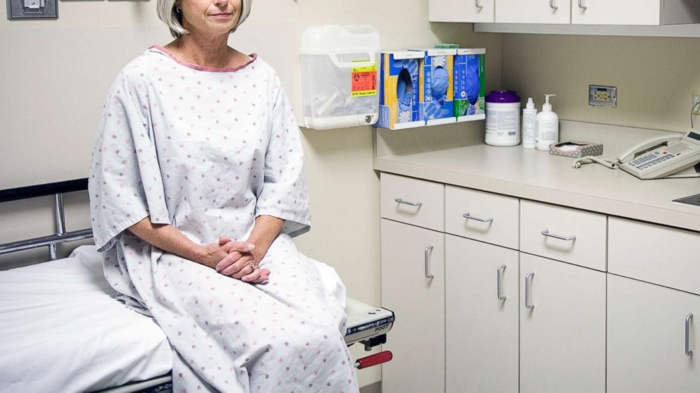 PHOTO: A woman sits in a doctor's office in this updated stock photo.