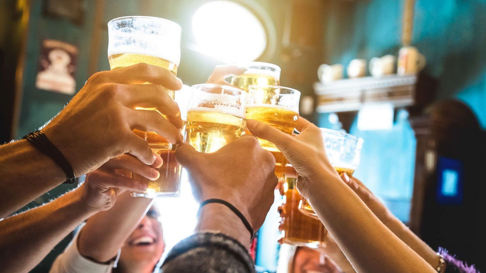 PHOTO: A group friends are pictured drinking and toasting beer in this undated stock photo.