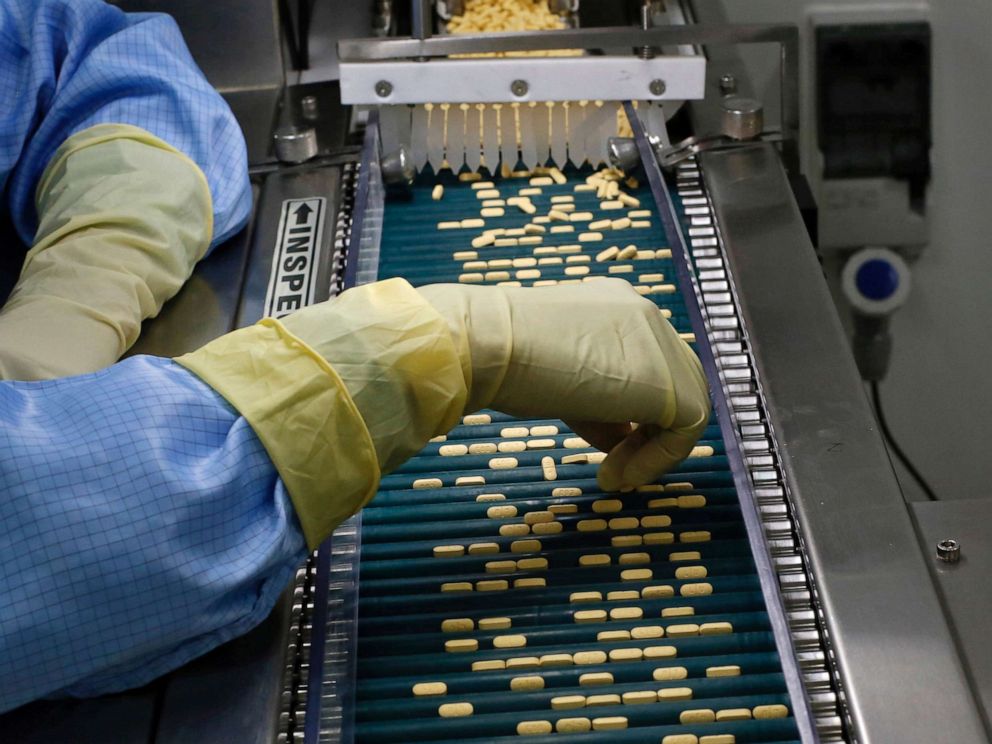 PHOTO: An employee inspects tablets as they move along the production line at a pharmaceutical plant of Lupin, India's No. 2 drugmaker, in Verna, in the western state of Goa, India, June 9, 2017.